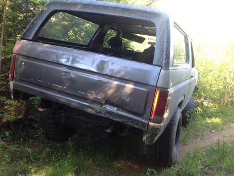 1979 Ford Bronco - This 1979 Ford Bronco shows significant damage to its rear tailgate and bumper area.