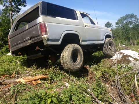 1979 Ford Bronco - This 1979 Ford Bronco is shown navigating a rocky, wooded terrain.