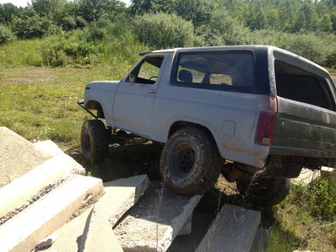 1979 Ford Bronco - This modified Ford Bronco is positioned on concrete blocks, suggesting off-road use.