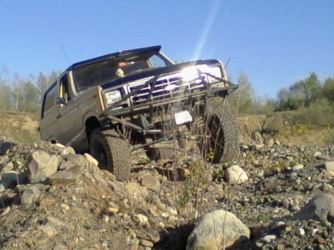 1979 Ford Bronco - This 1979 Ford Bronco navigates a challenging rocky landscape, its off-road capabilities.