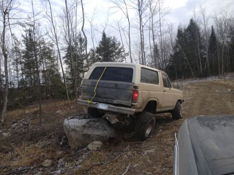 1979 Ford Bronco - This 1979 Ford Bronco is navigating a challenging off-road course, demonstrating its capabilities.
