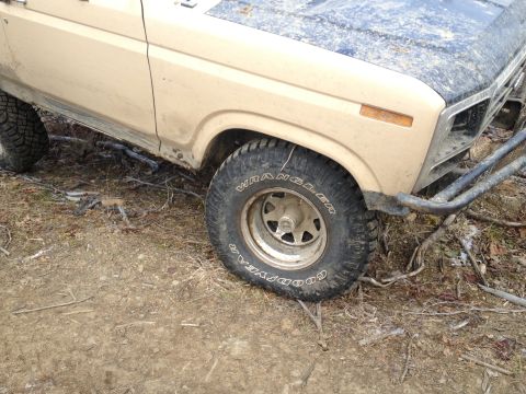 1979 Ford Bronco - This 1979 Ford Bronco is shown from the front 3/4 view, highlighting its off-road tires and custom bumper.