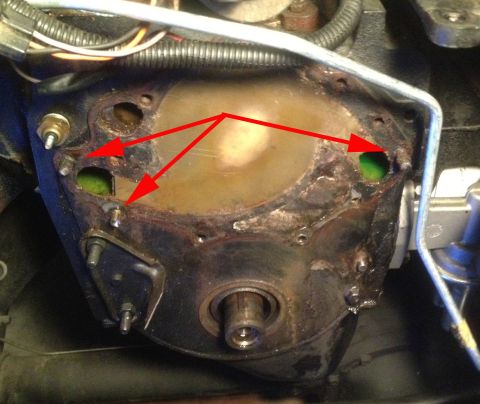 1978 Ford Bronco - Red arrows highlight green fluid leaking from an engine component, suggesting a potential issue.