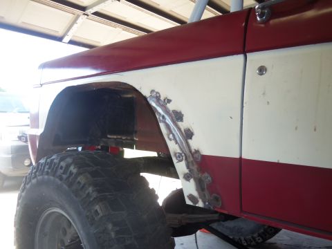 1968 Ford Bronco - This vehicle's rear wheel well is undergoing repair work, with fresh welds visible on the metal patch.