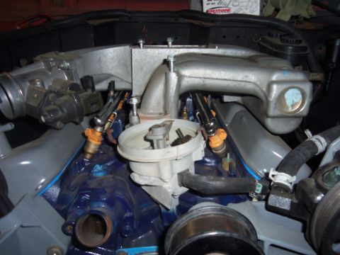 1968 Ford Bronco - Close-up view of an engine's intake manifold and fuel injection system.