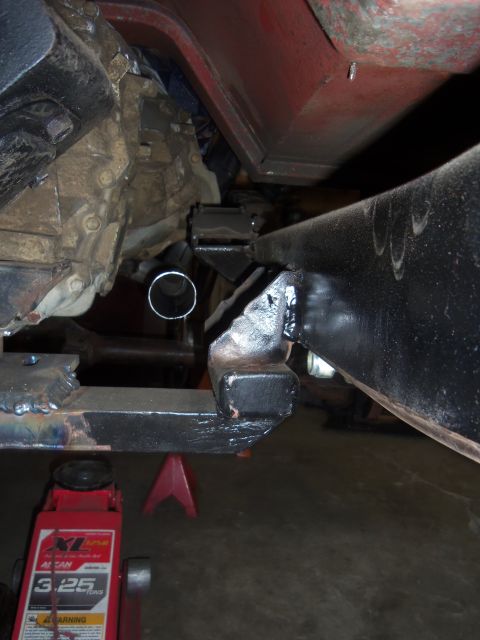 1968 Ford Bronco - Close-up view of the vehicle's undercarriage, focusing on the exhaust system and structural components.