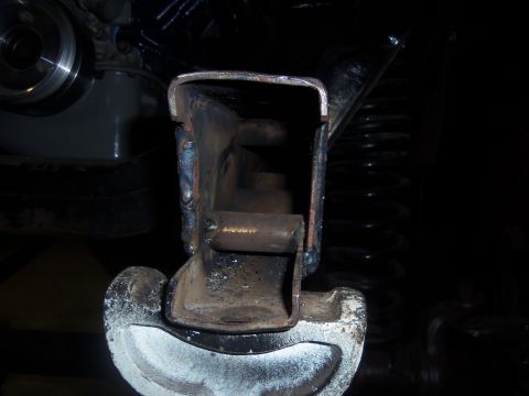 1968 Ford Bronco - This photo shows a close-up view of a welded metal bracket on a vehicle's frame, likely part of the steering or suspension system.