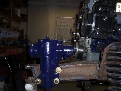 1968 Ford Bronco - Close-up view of a blue steering box and engine parts, possibly for a custom build or restoration project.
