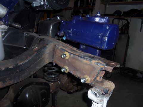 1968 Ford Bronco - Close-up of a vehicle's frame showing a newly painted blue steering gearbox and suspension components.