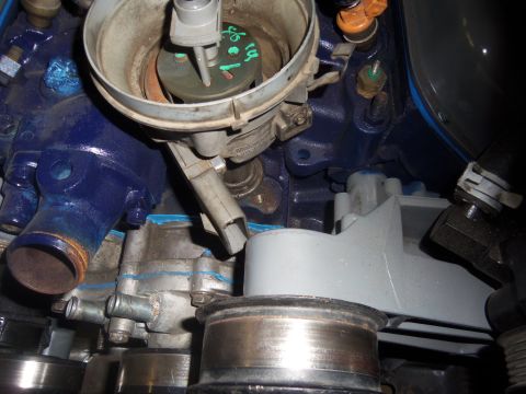 1968 Ford Bronco - Close-up view of an engine's distributor cap, showing internal components and green markings.