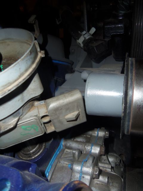 1968 Ford Bronco - Engine part with blue sealant, likely from a vehicle maintenance or repair.