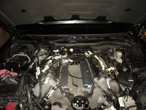 2004 Mercury Grand Marquis - The engine bay is filled with complex wiring and components, suggesting a recent modification or repair.