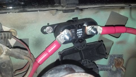 1995 Ford Bronco - Close-up of an automotive fuse holder with visible text indicating its specifications.
