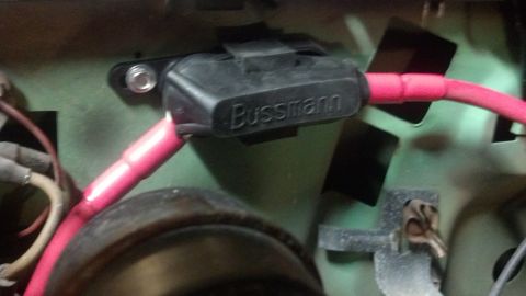 1995 Ford Bronco - Close-up of a Bussmann fuse holder connected to red electrical wires.