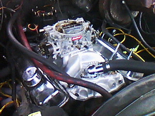 1975 Chevrolet Chevelle - Engine bay detail showing a carburetor and associated plumbing.
