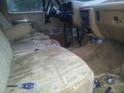 1988 Ford Bronco - Interior view of a 1988 Ford Bronco, showing the dashboard, seats, and steering wheel.