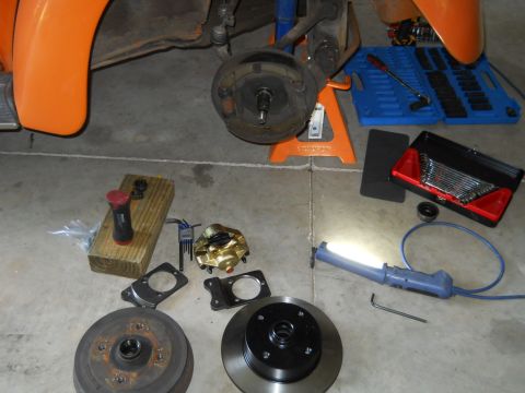 1992 Ford Bronco - Various car brake components and a set of wrenches are visible on the floor.