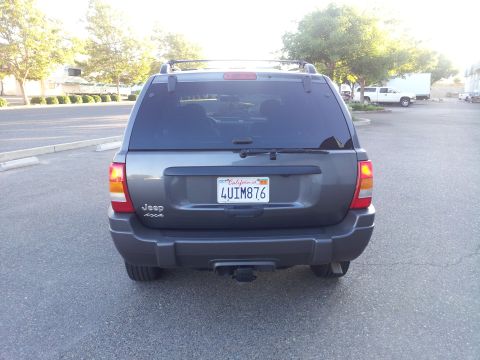 2002 Jeep Grand Cherokee - This Jeep Grand Cherokee is shown from the rear, its license plate and "Jeep 4x4" badging.