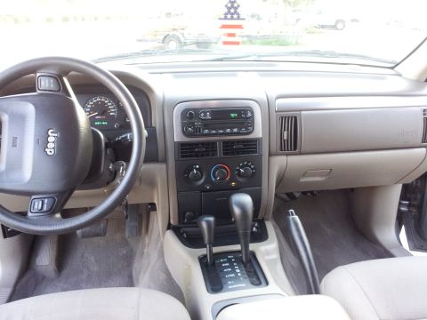 2002 Jeep Grand Cherokee - Interior view of a 2002 Jeep Grand Cherokee, showing the dashboard and controls.