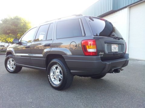 2002 Jeep Grand Cherokee - 2002 Jeep Grand Cherokee 4x4 exterior shot, showing rear and side profile.