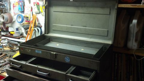 2004 Aston Martin Virage - Metal toolbox with drawers and internal compartments, a GE logo.