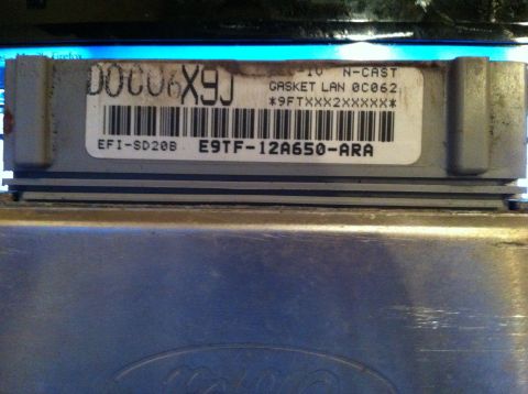 1990 Ford F-150 - Close-up of a Ford engine control module, part number E9TF-12A650-ARA.