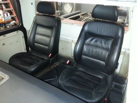 1967 Ford F-100 - Installed black leather bucket seats with headrests and seatbelts.