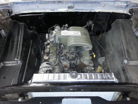 1967 Ford F-100 - View of the engine bay a V8 engine and an aluminum radiator, with "SUPERMOTORS.NET" visible at the bottom.