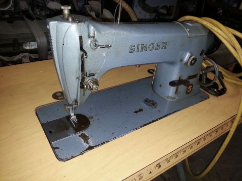 1967 Ford F-100 - Singer sewing machine with visible branding and a yellow power cord.