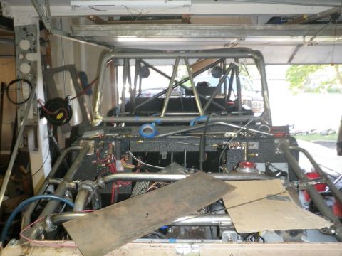 1961 International Scout 800 - Vehicle interior and engine bay showing custom fabrication work and exposed components.