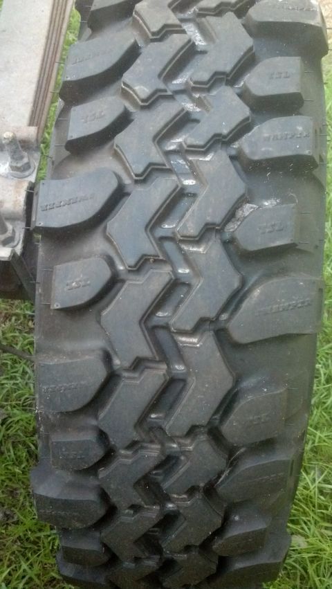 1983 Ford F-250 - A close-up view of a tire tread pattern is shown, with some text visible on the sidewall.