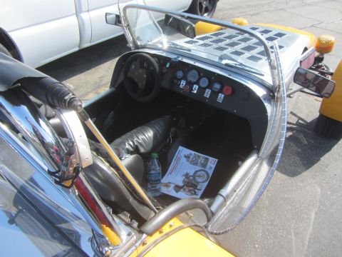 1964 Ford Ranchero - Interior view of a custom car with a white pickup truck visible in the background.