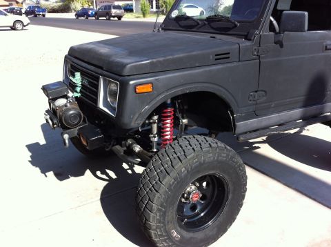 1987 Suzuki Samurai - Modified 1987 Suzuki Samurai features a winch and lifted suspension for off-road use.