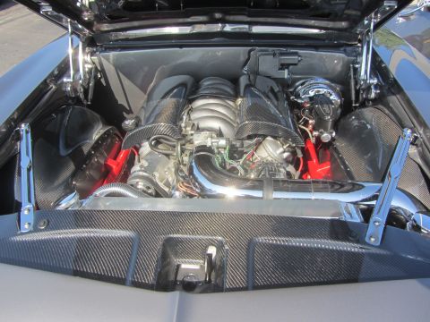 1964 Ford Ranchero - A custom engine bay with a modern V8 engine, carbon fiber accents and polished chrome components.