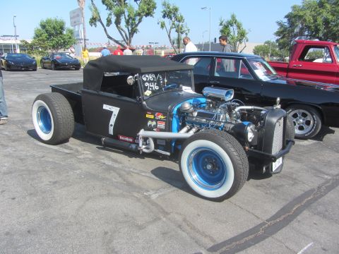 1964 Ford Ranchero - Custom hot rod pickup truck with a prominent number 7 on its side and a highly visible engine.
