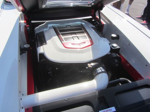 1964 Ford Ranchero - Engine bay of a Corvette, a custom white engine cover with red trim and the Corvette emblem.