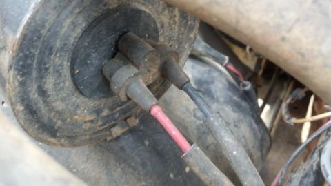 1993 Ford Bronco - Spark plug wires and distributor cap detail, likely from an older vehicle's engine bay.