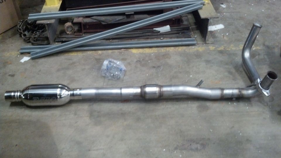 Exhaust system pipe with muffler and catalytic converter