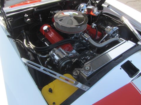 1964 Ford Ranchero - Detailed view of a car's engine bay, showing the motor and surrounding components.
