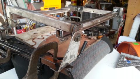 1991 Ford Festiva - Custom metal fabrication is being attached to a car seat.
