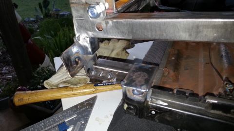 1991 Ford Festiva - Close-up view of a welded metal frame, showing bolts and construction details.