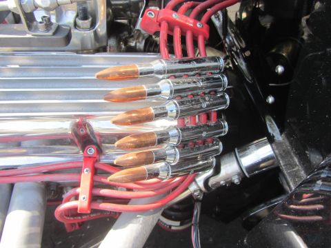 1964 Ford Ranchero - Custom engine bay modification features spark plug wire holders designed to look like bullets.