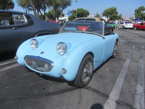 1964 Ford Ranchero - Austin-Healey Sprite convertible with distinctive round headlights and chrome grille.