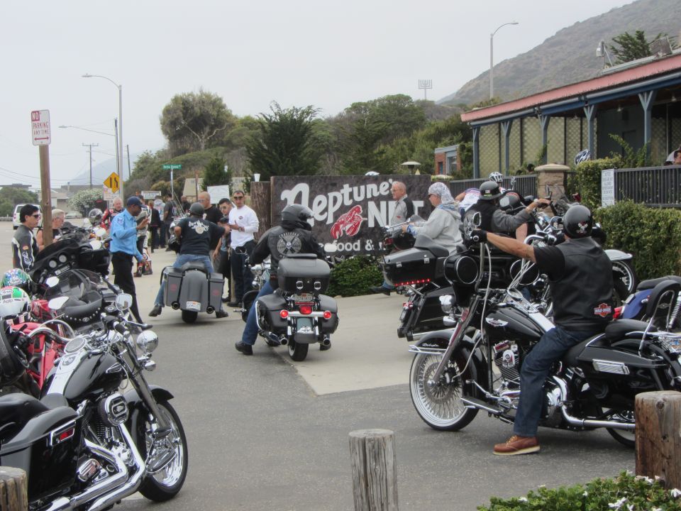 Motorcycles parked outside Neptune's Net restaurant with people gathered