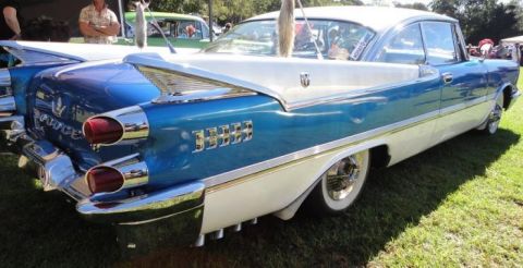 1991 Ford LTD Crown Victoria - Rear view of a classic two-tone blue and white 1959 Dodge Custom Royal with prominent tail fins.