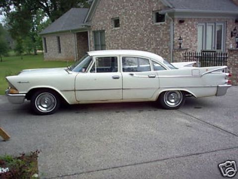 1991 Ford LTD Crown Victoria - This four-door sedan features distinctive tail fins and a classic body style from the late 1950s.