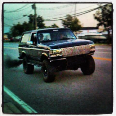 1995 Ford Bronco - This 1995 Ford Bronco is seen driving and producing a large amount of black smoke.