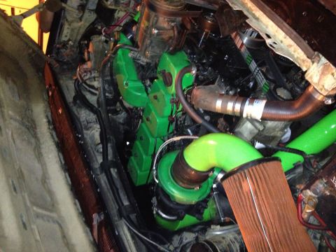 1995 Ford Bronco - Custom engine modifications are visible in this engine bay, bright green components and a turbocharger.