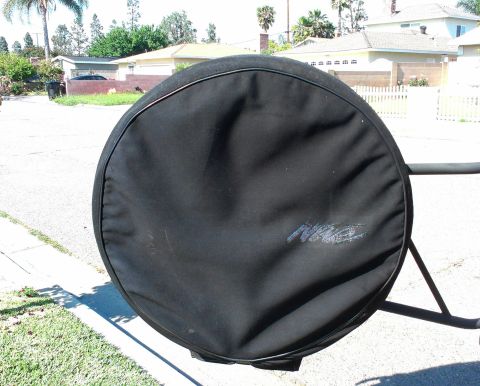 1994 Ford Bronco - A black spare tire cover with a blue 'Nite' logo is visible, mounted on a rack outside.