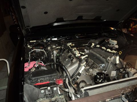 2004 Mercury Grand Marquis - Engine bay with hood open, revealing engine components and wiring harnesses.